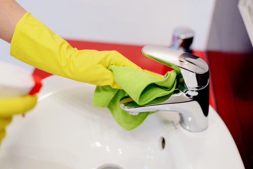 Cleaning technician preparing carpet cleaning equipment safely