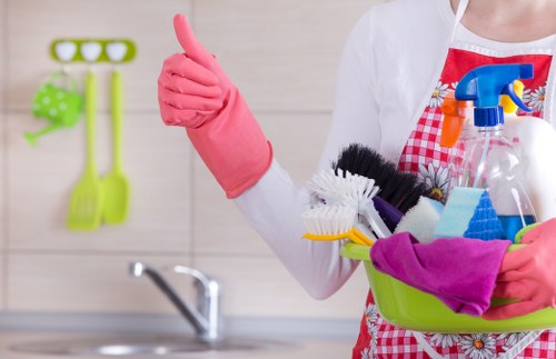 Professional carpet cleaner discussing booking details and service scope